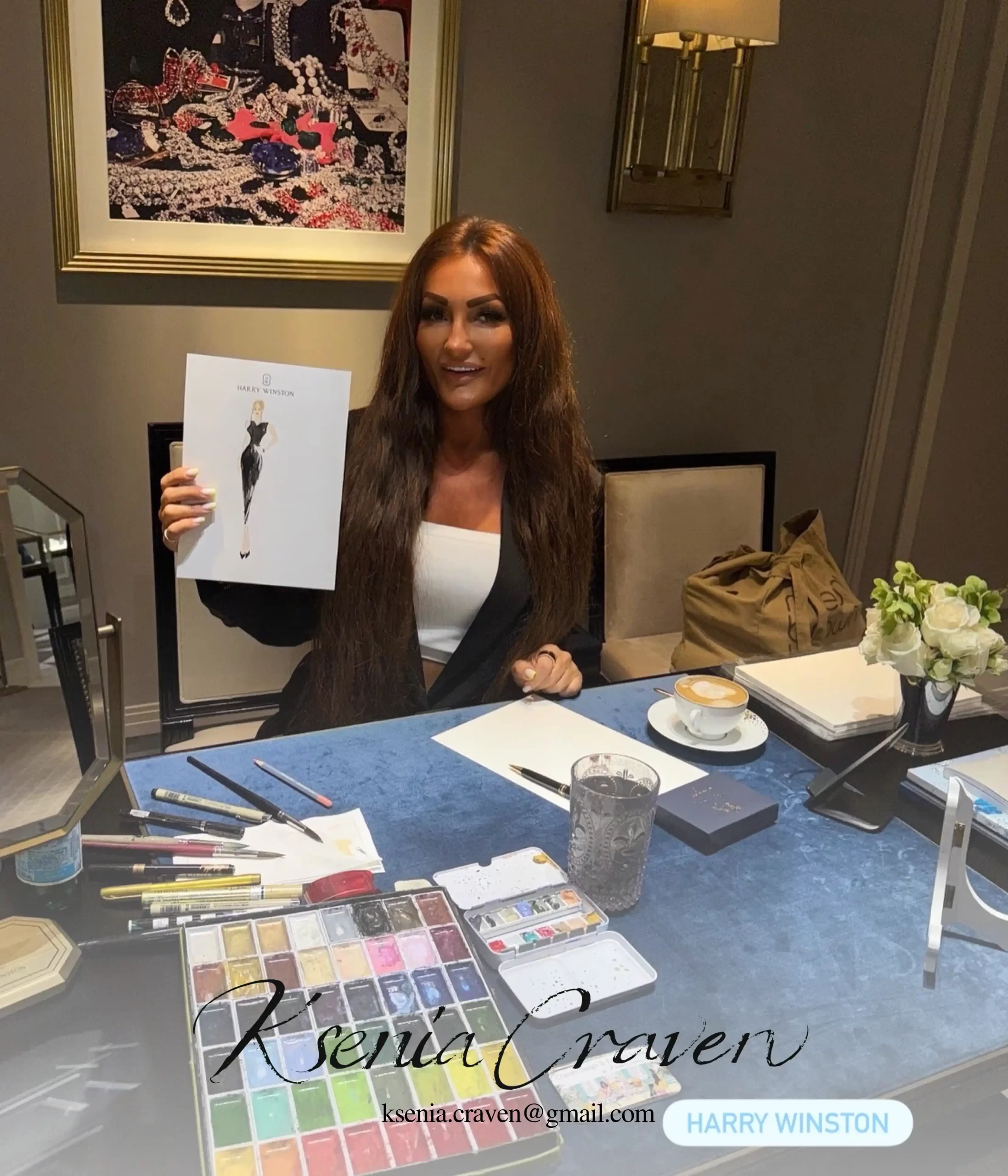 Fashion illustrator Ksenia Craven holding a custom watercolor sketch at a luxury Harry Winston event.