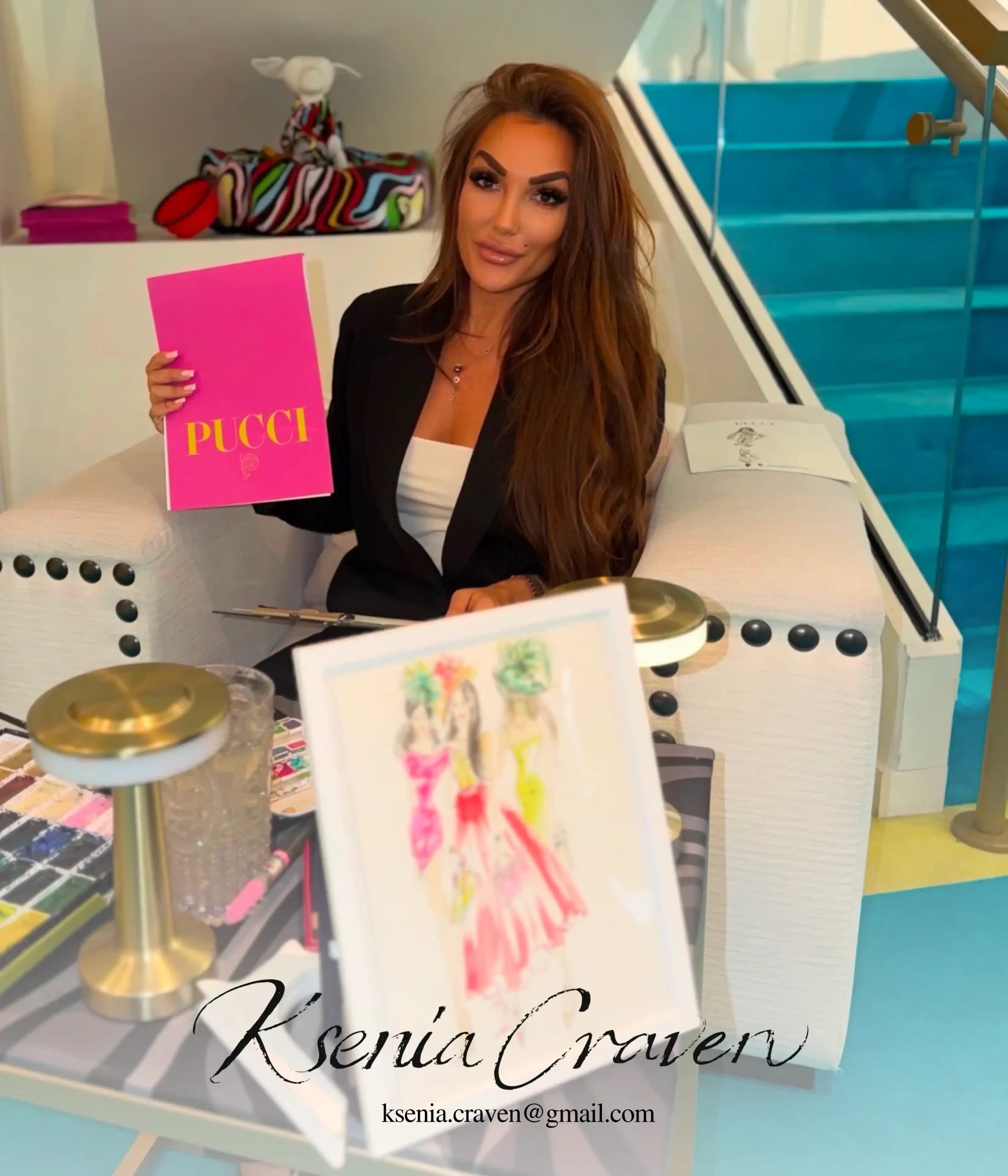Fashion illustrator Ksenia Craven holding a Pucci folder next to a custom watercolor sketch at a live event.