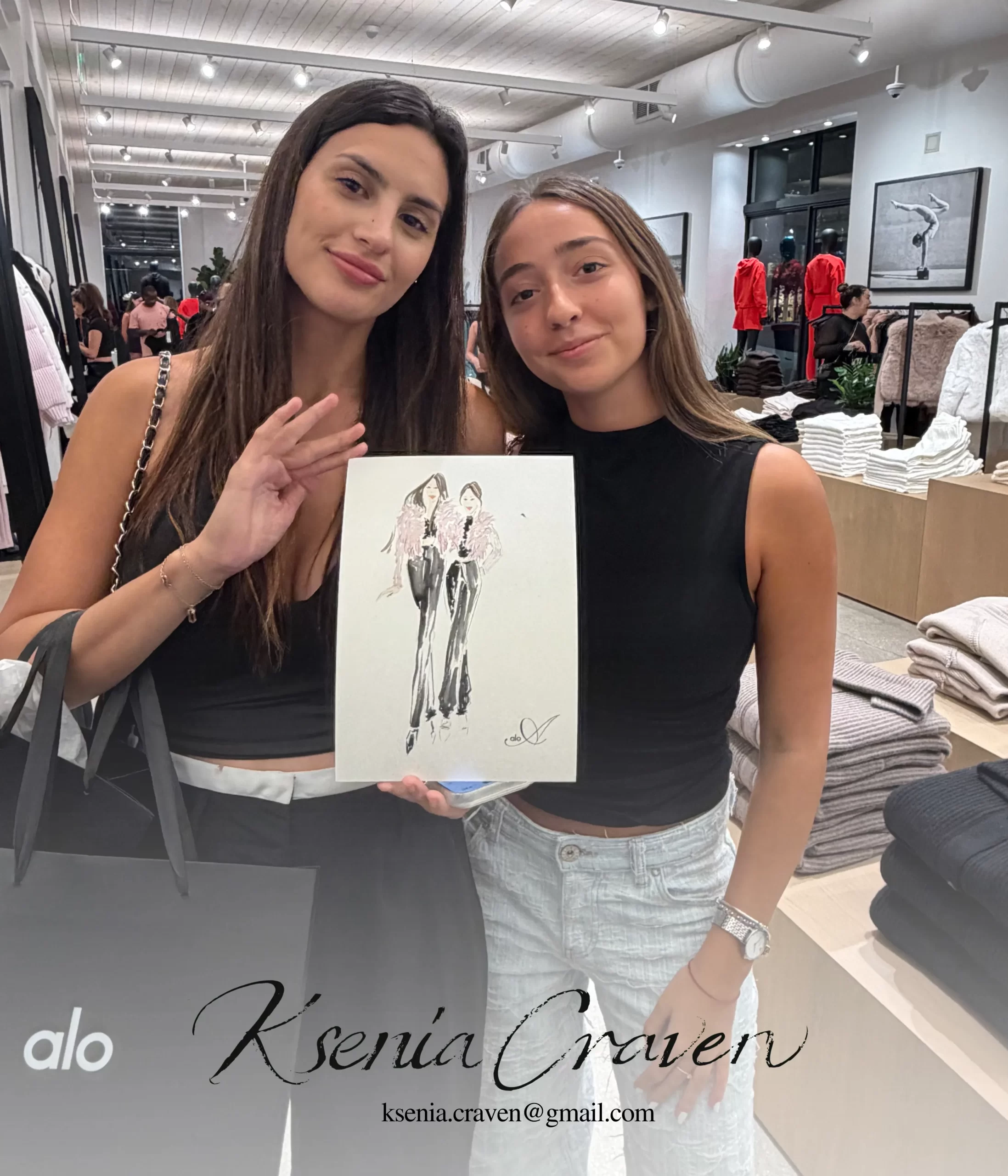 Two women in a retail store holding a custom hand-drawn fashion illustration by Ksenia Craven.